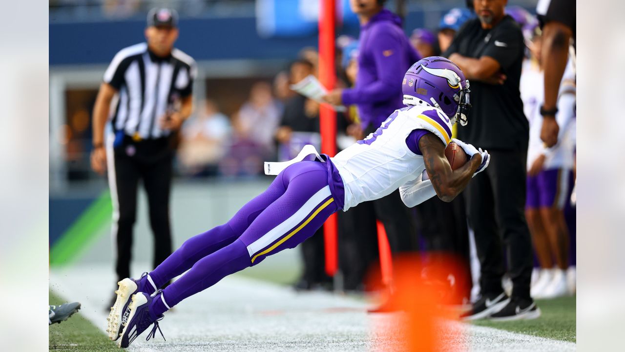 Minnesota Vikings running back Ty Chandler (32) runs with the ball during  an NFL pre-season football game against the Seattle Seahawks, Thursday,  Aug. 10, 2023 in Seattle. (AP Photo/Ben VanHouten Stock Photo 