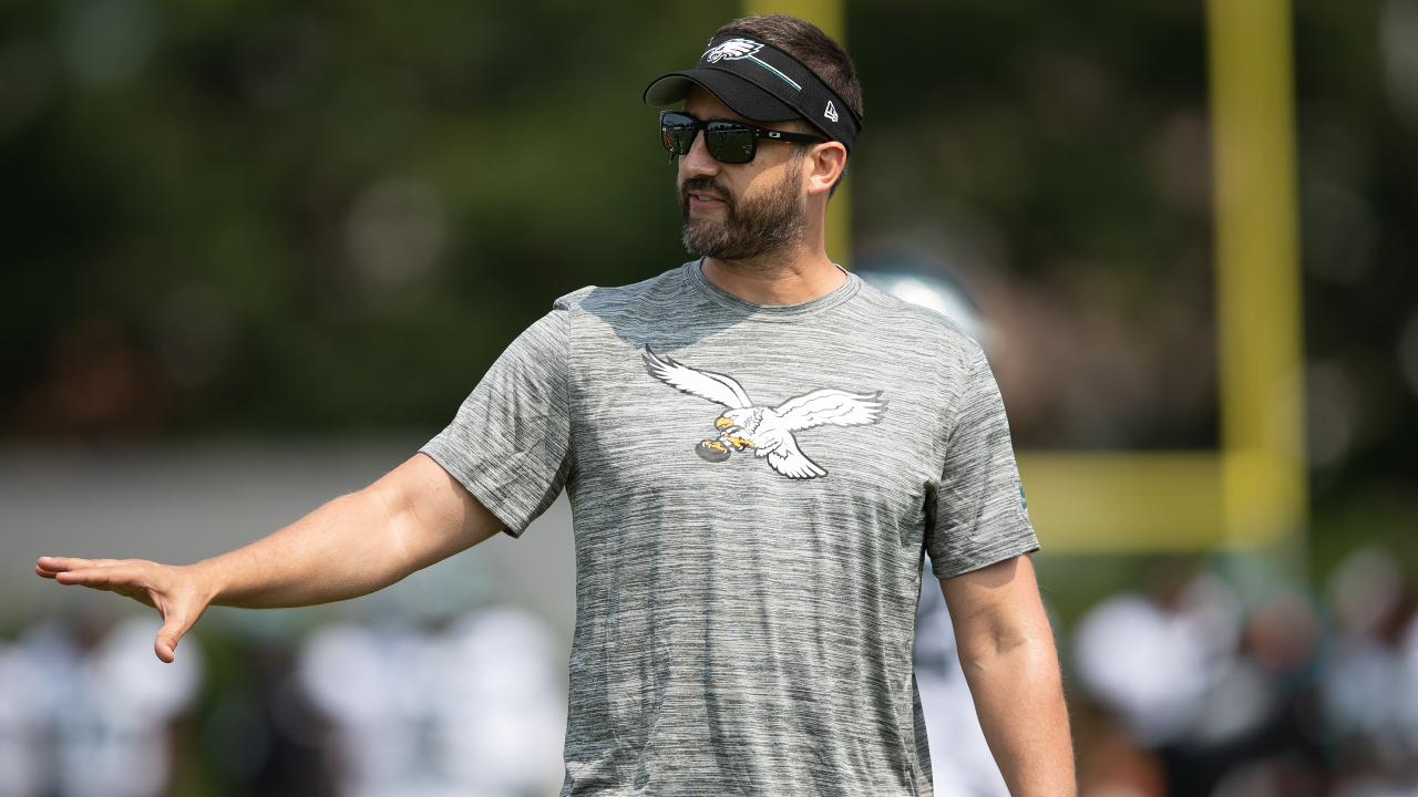 Philadelphia Eagles' Tanner McKee, left, talks to a member of the military  after handing over his jersey during practice at NFL football training  camp, Sunday, July 30, 2023, in Philadelphia. (AP Photo/Chris