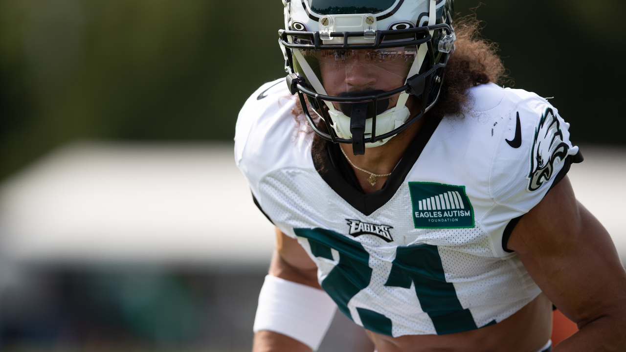 Philadelphia Eagles' Tanner McKee, left, talks to a member of the military  after handing over his jersey during practice at NFL football training  camp, Sunday, July 30, 2023, in Philadelphia. (AP Photo/Chris