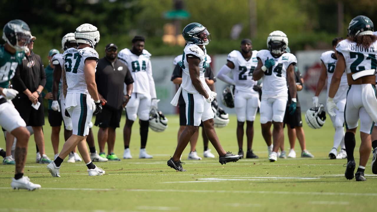 Philadelphia Eagles' Tanner McKee, left, talks to a member of the military  after handing over his jersey during practice at NFL football training  camp, Sunday, July 30, 2023, in Philadelphia. (AP Photo/Chris