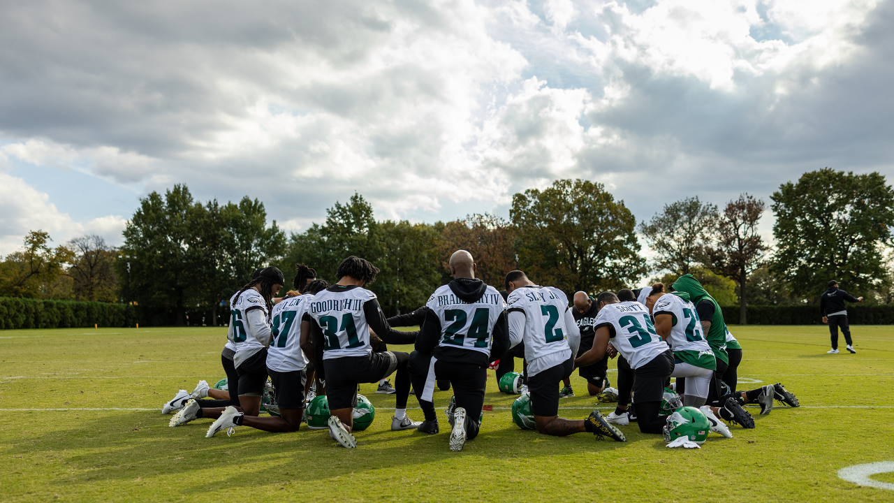 The DBs gather after practice.