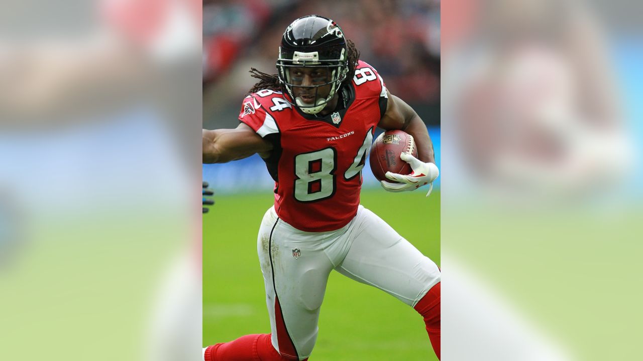 Atlanta Falcons' Roddy White (left) is tackled by Detroit Lions