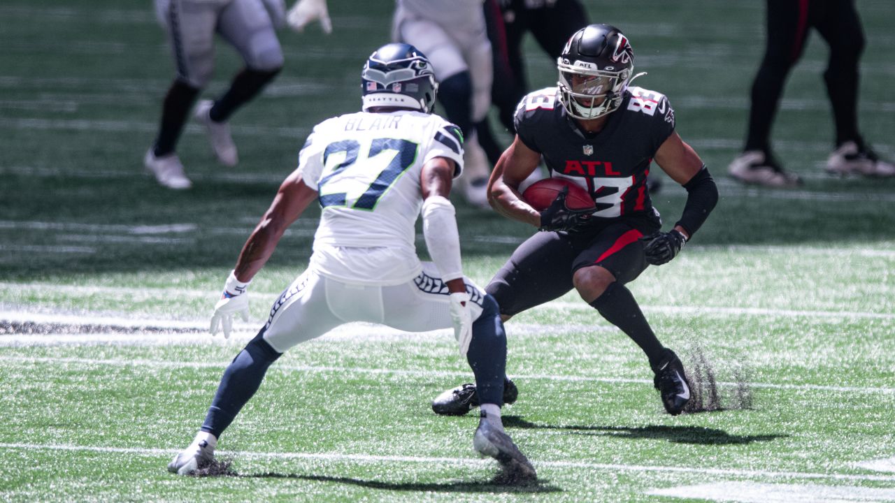 Seattle Seahawks wide receiver DK Metcalf is tackled in the endzone by  Atlanta Falcons safety Jaylinn Hawkins after catching a pass for a  touchdown in an NFL football game, Sunday, Sept. 25