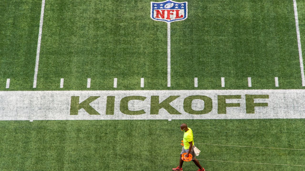 Watch as throwback logos and endzones are painted on the field at  Mercedes-Benz Stadium