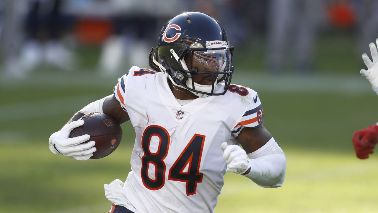 Minnesota Vikings fullback C.J. Ham (30) runs with the ball during the  first half of an NFL football game against the Chicago Bears, Sunday, Jan.  8, 2023, in Chicago. (AP Photo/Kamil Krzaczynski