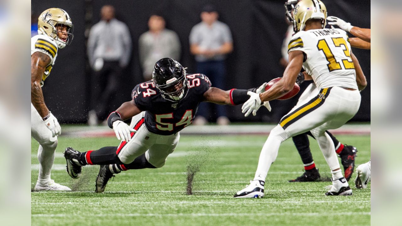 Atlanta Falcons linebacker Foye Oluokun (54) tackles Carolina Panthers wide  receiver Robby Ande …