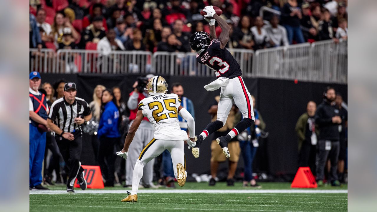 Atlanta Falcons wide receiver Christian Blake #13 runs out of the tunnel  during pregame against the …