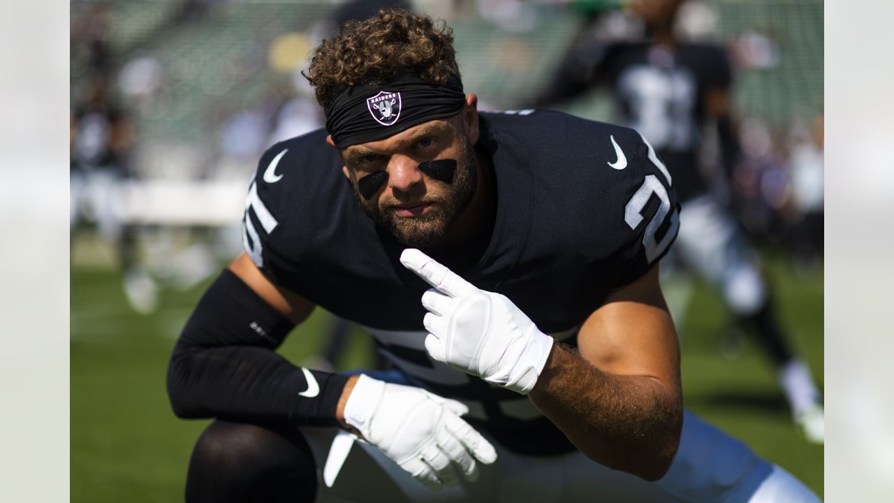 Las Vegas Raiders defensive end Maxx Crosby (98) salutes the crowd in the  first half during an …