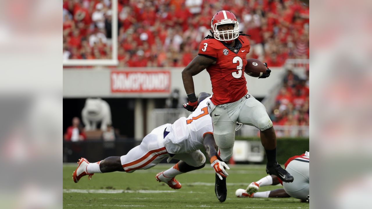 Atlanta Falcons running back Todd Gurley, 21, and Damontae Kazee, 27, walk  off the field after falling 30-26 to the Chicago Bears in an NFL football  game on Sunday, Sept. 27, 2020