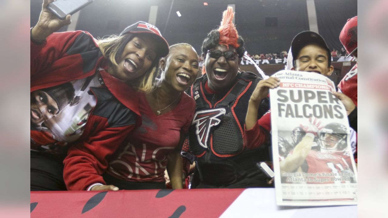 Atlanta Falcons owner Arthur Blank (L) dances with players after defeating  the Green Bay Packers 44-21 to win the NFC Championship game at the Georgia  Dome on January 22, 2017 in Atlanta.