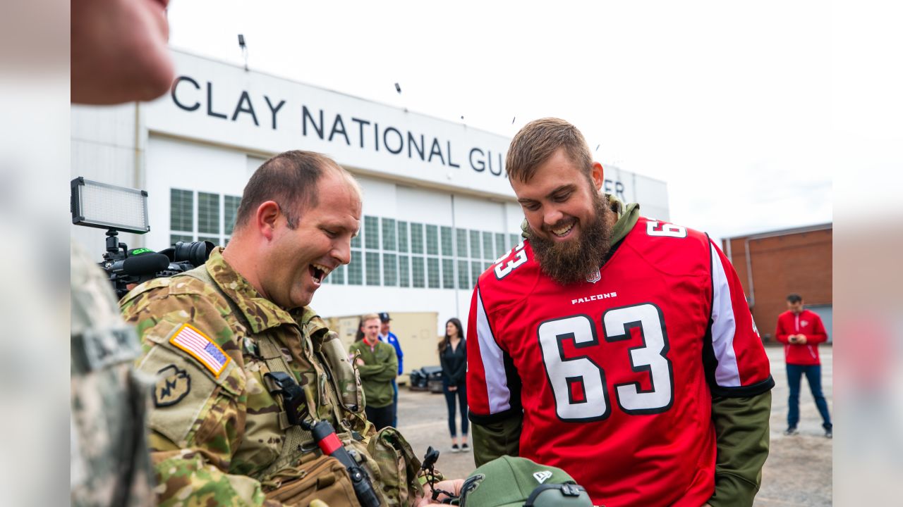 Cincinnati football teams wear Army National Guard camouflage uniforms