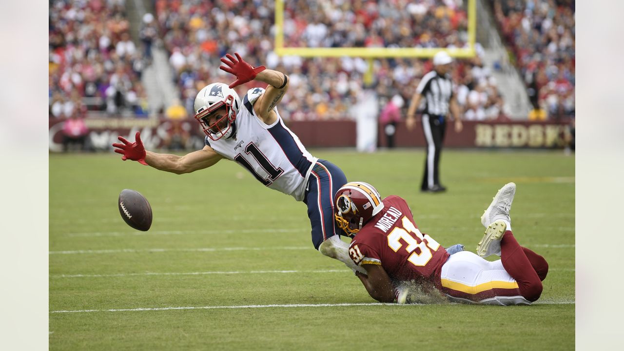 New York Giants cornerback Julian Love (37) tackles New England Patriots  wide receiver Julian Edelman in the first half of an NFL preseason football  game, Thursday, Aug. 29, 2019, in Foxborough, Mass. (