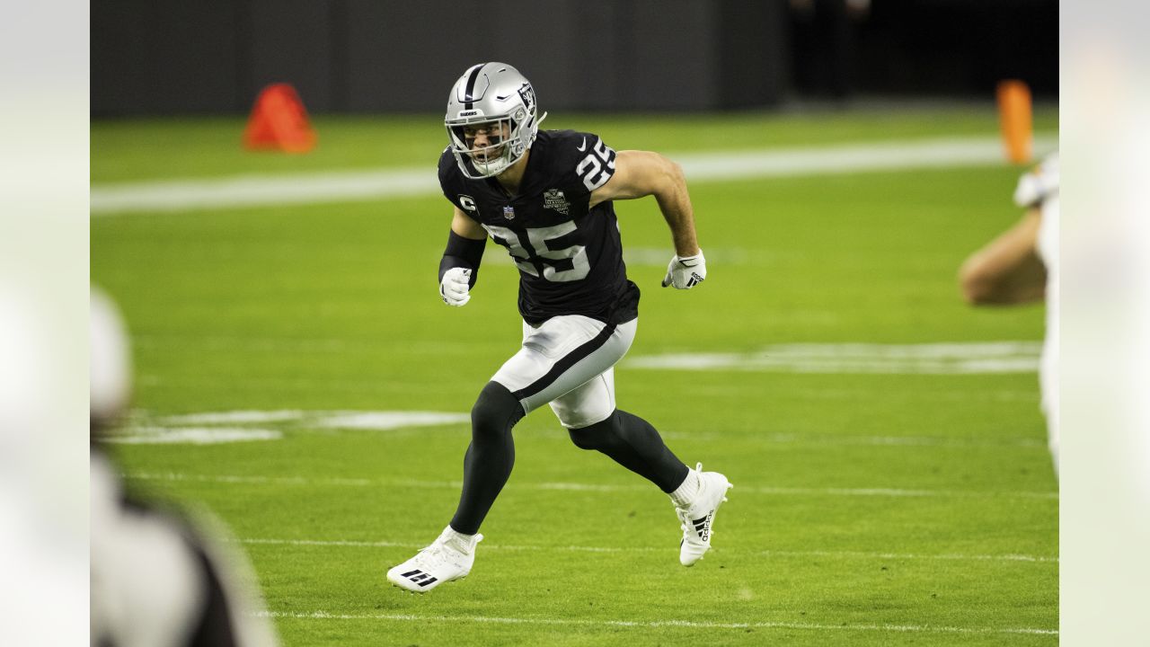 Las Vegas Raiders defensive end Maxx Crosby (98) salutes the crowd in the  first half during an …