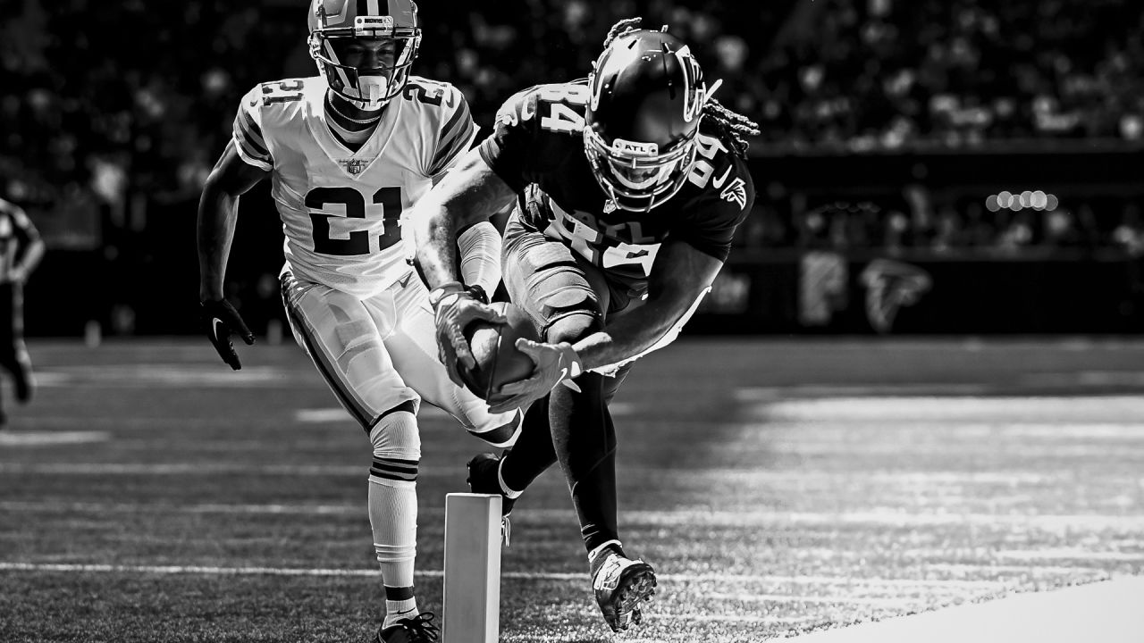 Jacksonville Jaguars vs. Cleveland Browns. NFL Game. American Football  League match. Silhouette of professional player celebrate touch down.  Screen in background. Stock Photo