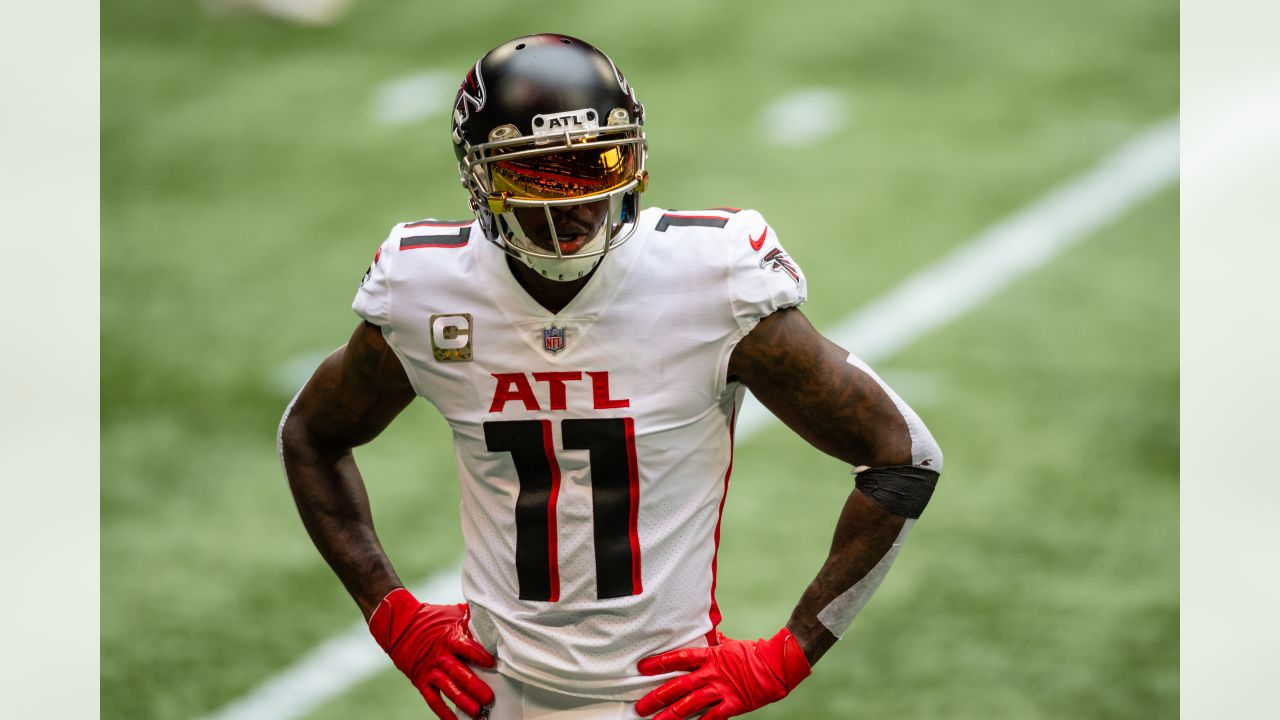 Julio Jones, wide receiver for Alabama, and number six overall pick, holds  up his new jersey after being selected by Atlanta during round one of the  2011 NFL Draft Pick at Radio