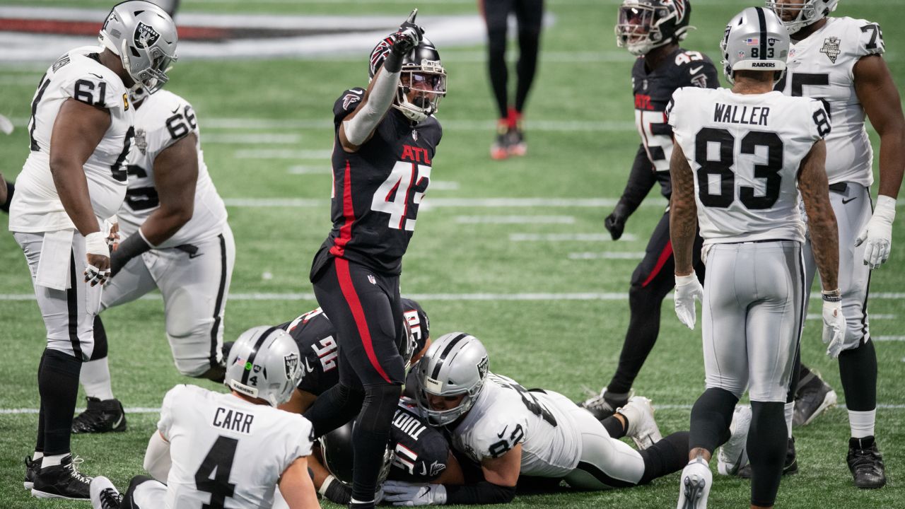 Las Vegas Raiders tight end Darren Waller (83) is tackled by Atlanta  Falcons cornerback A.J. Terrell (24) during the second half of an NFL  football game, Sunday, Nov. 29, 2020, in Atlanta.