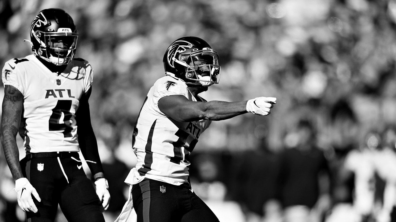 Tampa Bay Buccaneers vs. Carolina Panthers. NFL Game. American Football  League match. Silhouette of professional player celebrate touch down.  Screen in background. Stock Photo