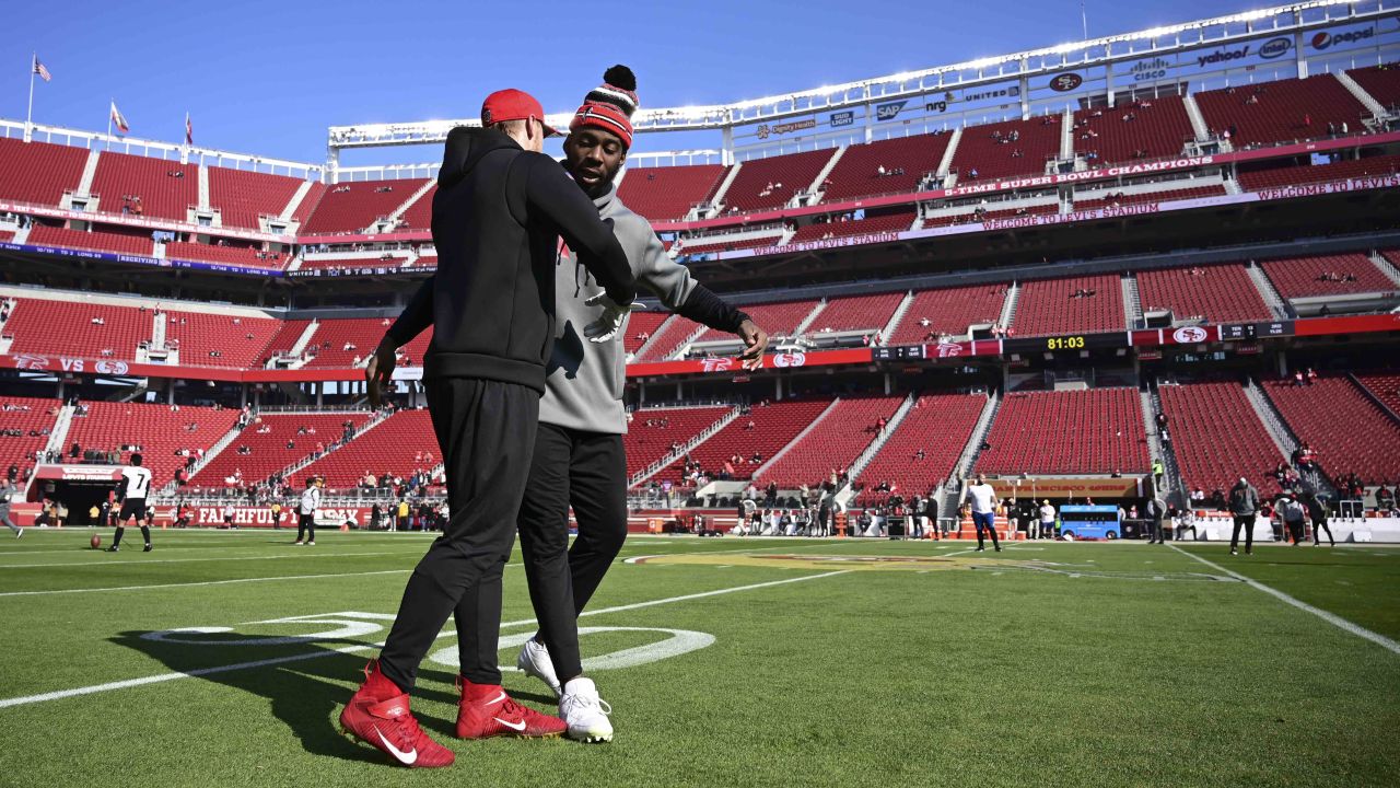 San Francisco 49ers tight end George Kittle (85) walks on the field wearing  a Crucial Catch hoody before an NFL football game against the Seattle  Seahawks, Sunday, Oct. 3, 2021 in Santa