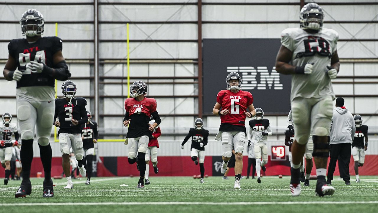 Atlanta Falcons guard Ryan Neuzil (64) works during the first half of an  NFL football game