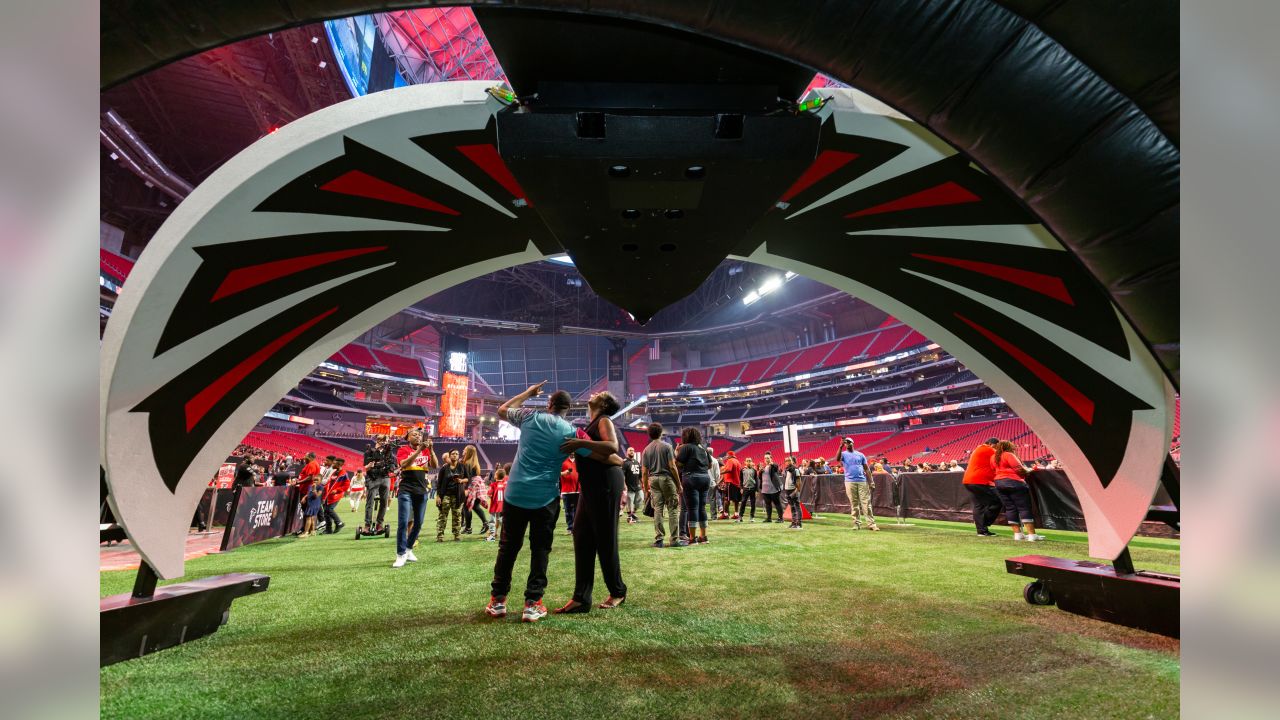 Rapper T.I. looks out from a suite during a tour of Mercedes-Benz Stadium,  the new stadium for the Atlanta Falcons NFL football team under  construction in Atlanta, Tuesday, April 25, 2017. (AP