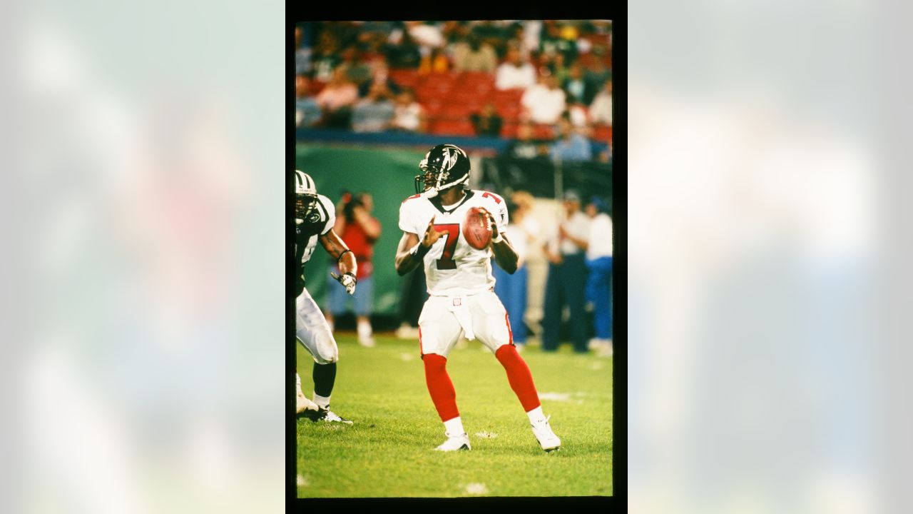 FILE** Atlanta Falcons quarterback Michael Vick stands on the