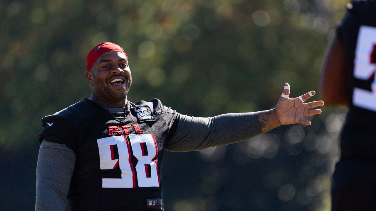 Atlanta Falcons defensive tackle Mike Pennel (98) walks off the