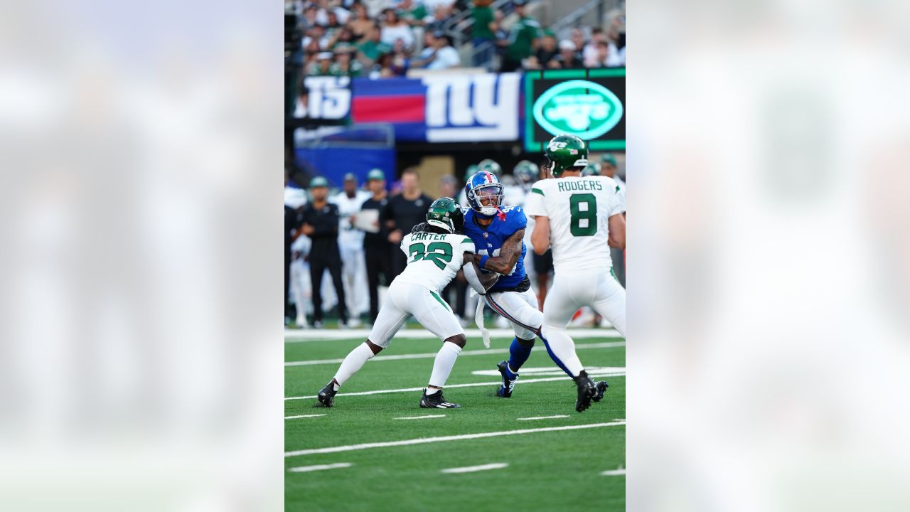 New York Jets defender Kris Jenkins, left, lines up Washington Redskins  running back Willie Parker for a tackle during preseason action at the New  Meadowlands Stadium in East Rutherford, New Jersey, Friday