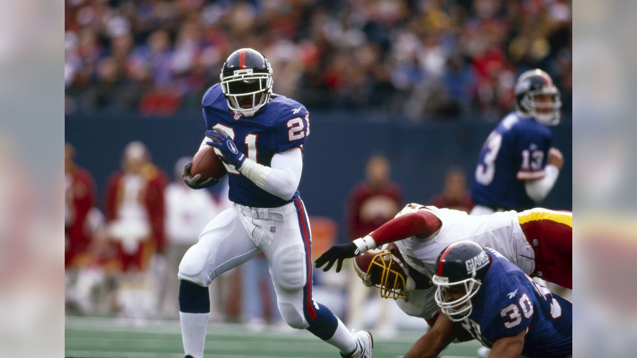 New York Giants receiver Ed McCaffrey snares a 17-yard pass from  quarterback Jeff Hostetler over Washington Redskins cornerback R. J.  Johnson (47) during the second quarter of game at RFK Stadium in