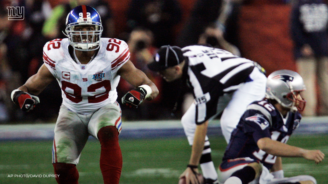 Middle linebacker Chase Blackburn (93) of the New York Giants celebrates  after making an interception against the New England Patriots during Super  Bowl XLVI at Lucas Oil Stadium in Indianapolis, Indiana, USA