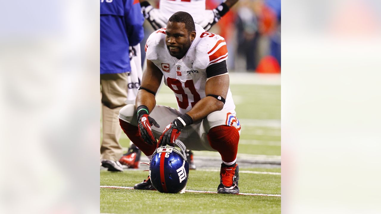 New York Giants defensive end Justin Tuck (91) pumps up the crowd during  second half NFL action in the New York Giants' 31-18 victory over the  Carolina Panthers at New Meadowlands Stadium