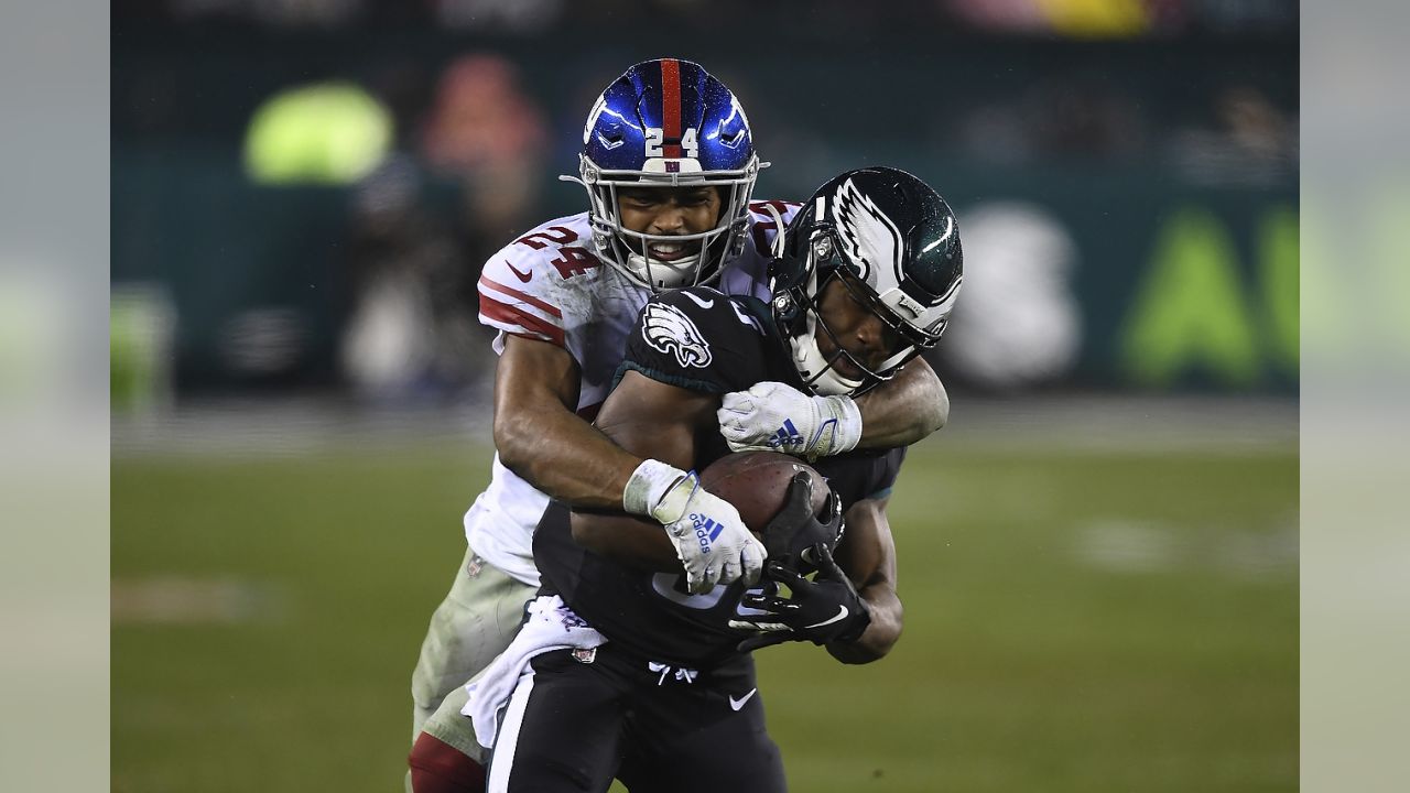 New York Giants cornerback Julian Love (37) tackles New England