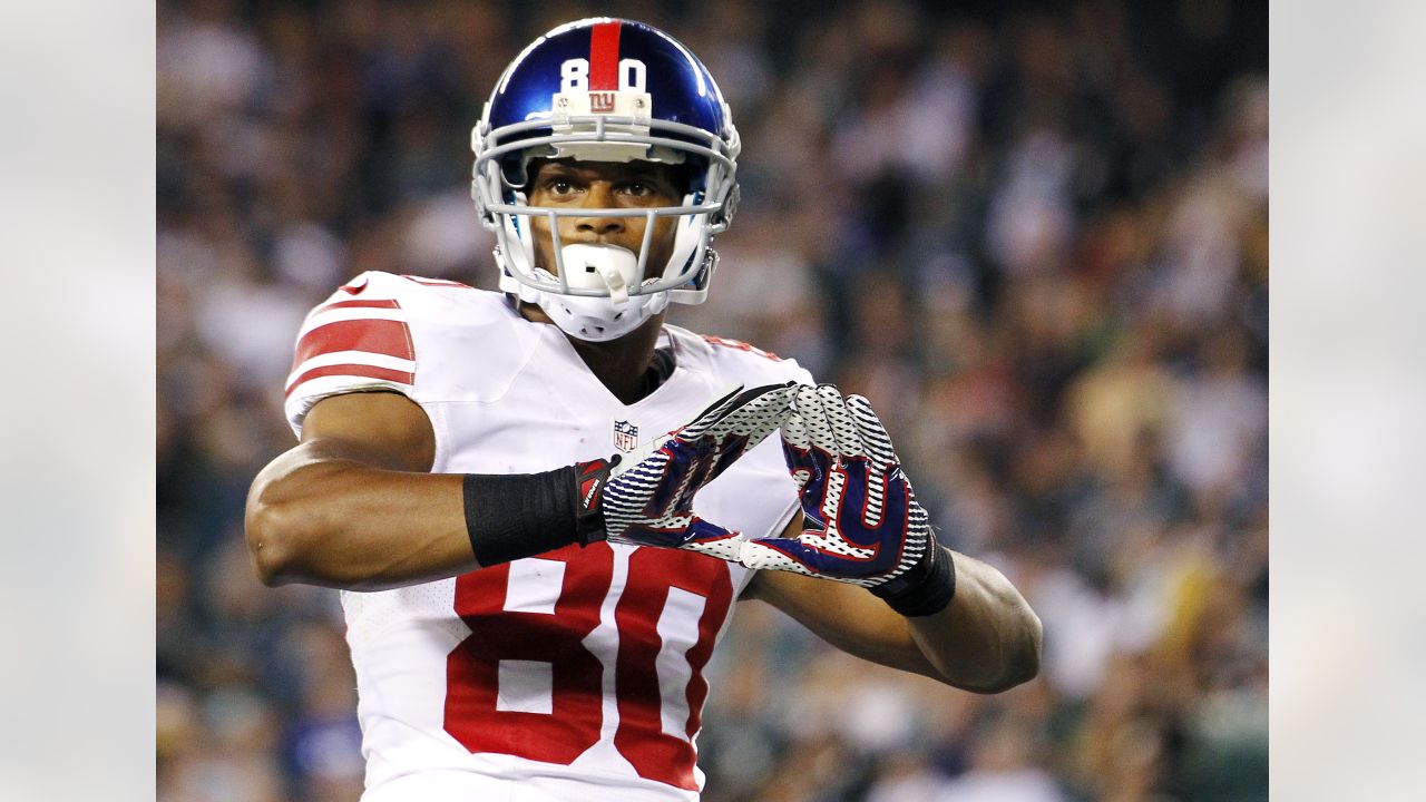 New York Giants - Super Bowl Football New York Giants wide receiver Victor  Cruz (80) holds the Vince Lombardi Trophy during the Super Bowl XLVl  football game against the New England Patriots