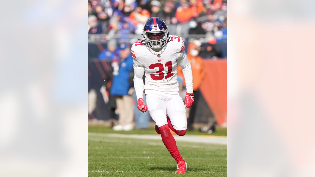 New York Giants fullback Elijhaa Penny (39) and defensive back Steven  Parker (38) react after a defensive play against the Washington Football  Team during the first quarter of an NFL football game, Sunday, Jan. 9,  2022, in East Rutherford, N.J. (AP Pho