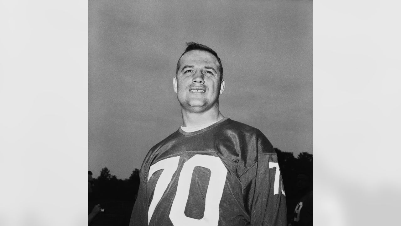 Washington Redskins defensive captain Sam Huff poses in front of