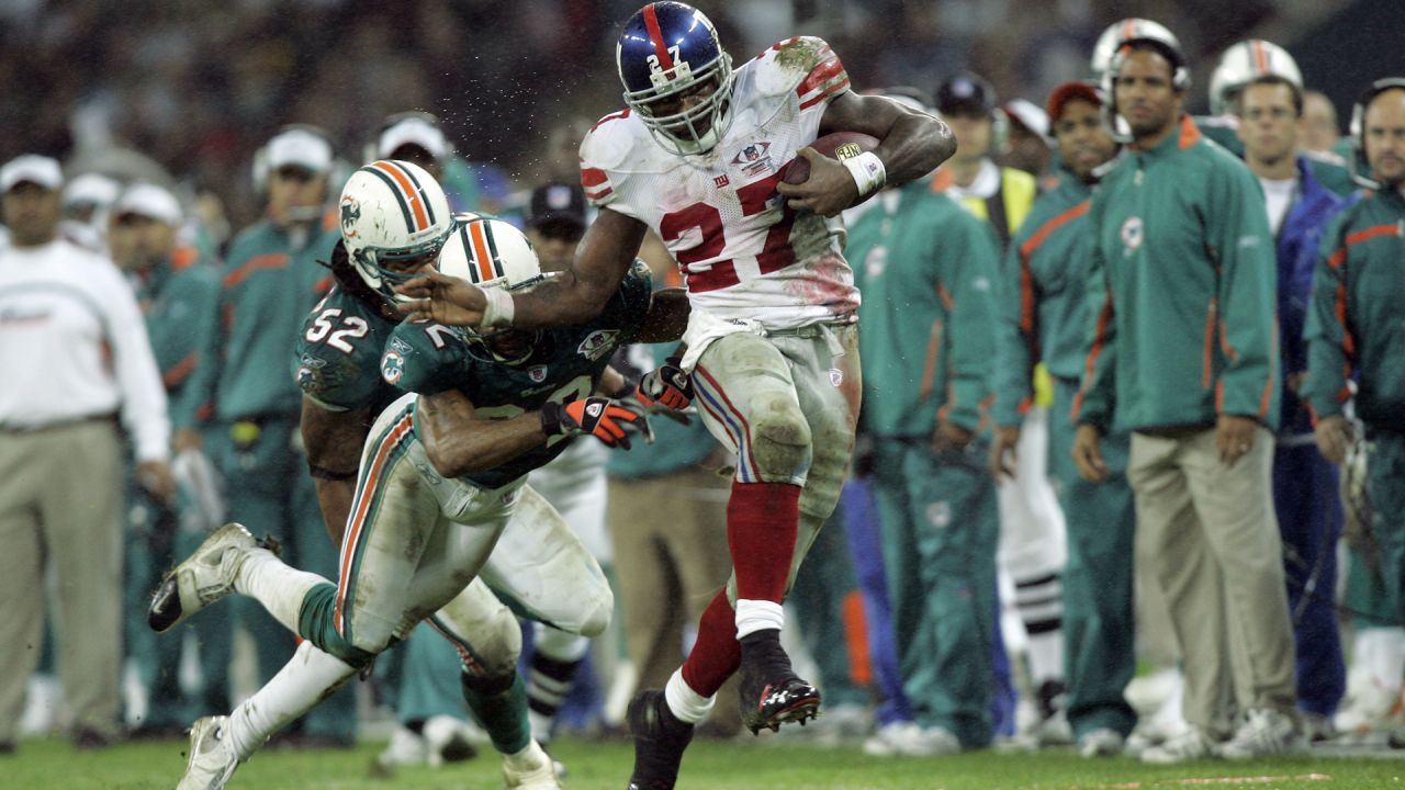 San Francisco 49ers' Sean Ryan (81) is tackled by Miami Dolphin's Channing  Crowder (52) after catching an 8 yard pass in third quarter action at  Dolphin Stadium in Miami on December 14