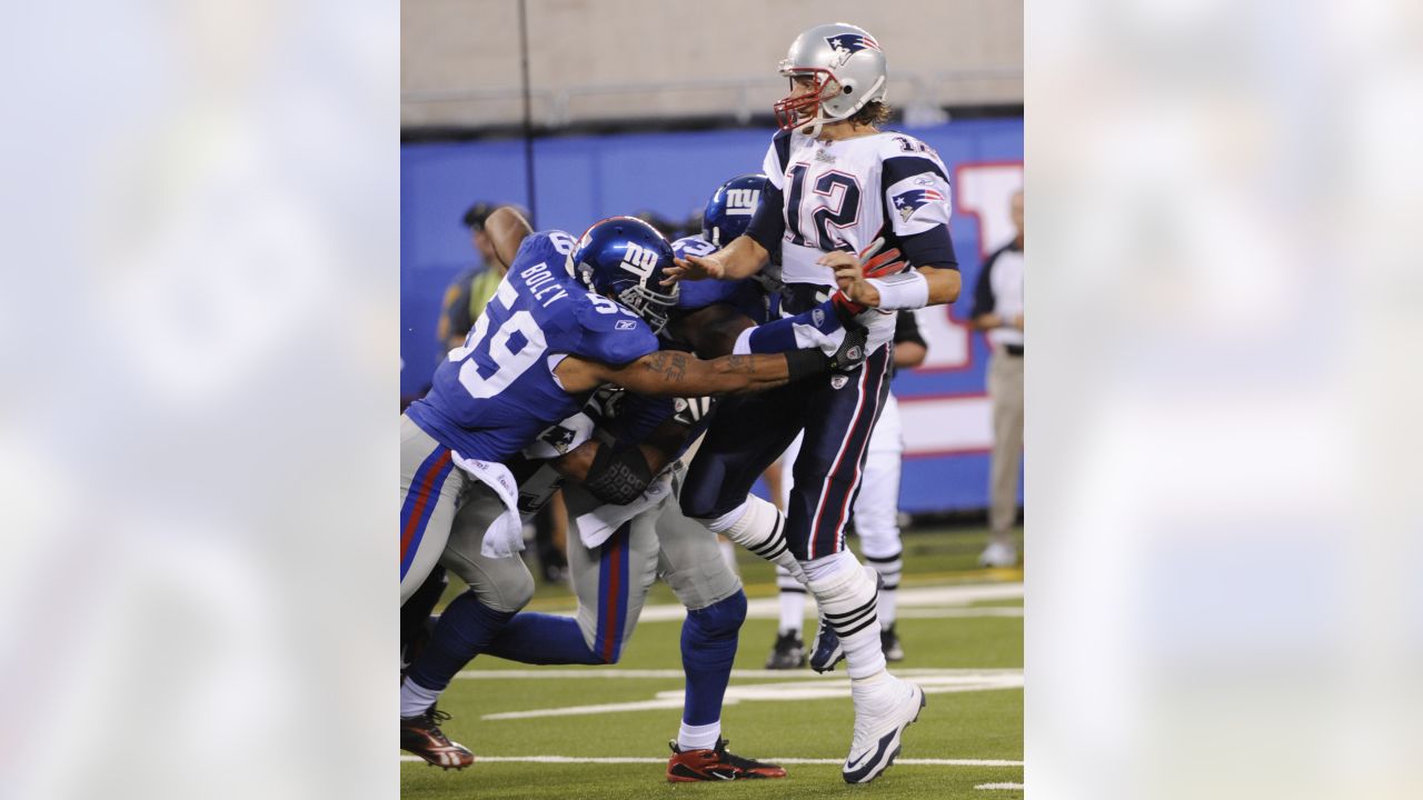 29 December 2007: New England Patriots Tom Brady #12 leaves the field after  the game against the New York Giants at Giants Stadium in East Rutherford,  NJ. The Patriots beat the Giants