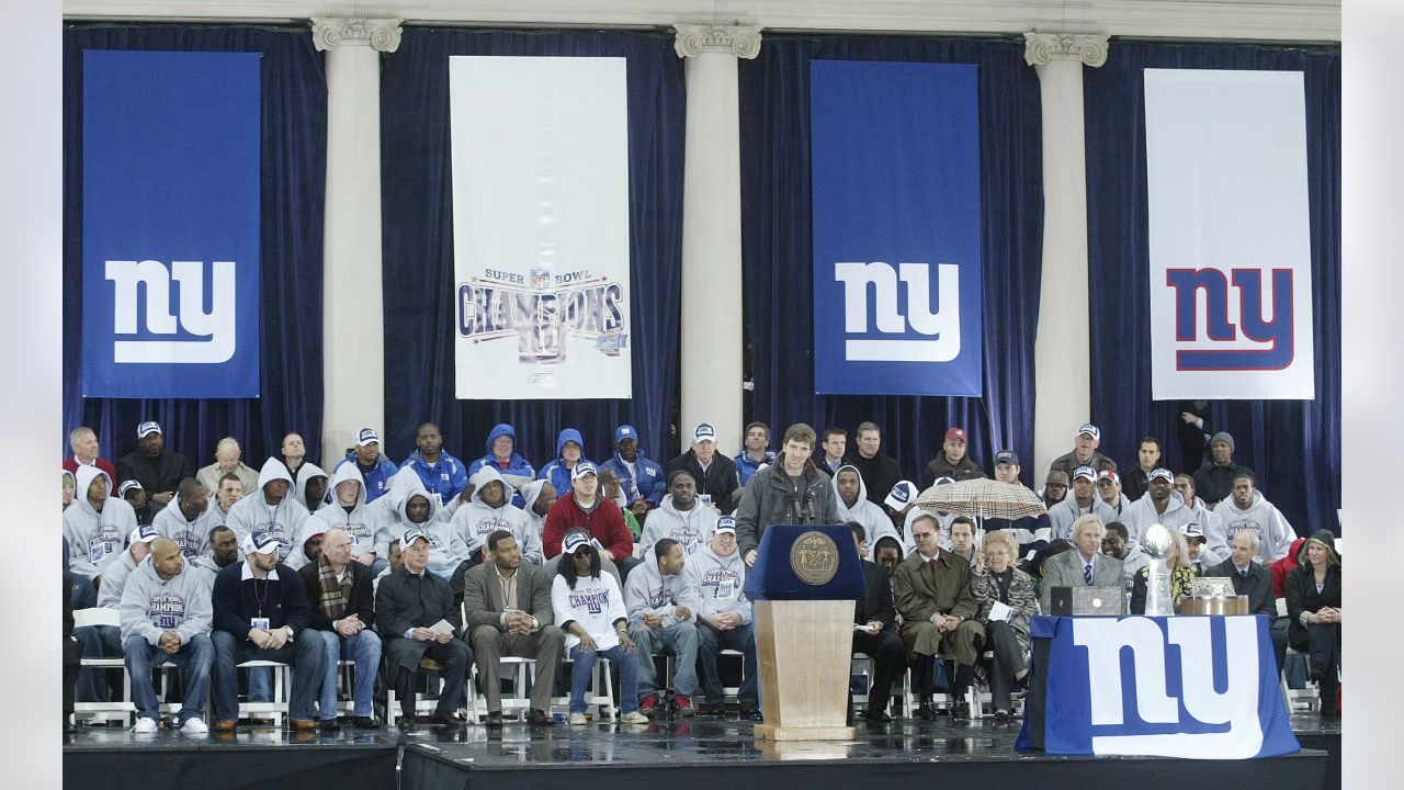 New York Giants Michael Strahan reacts while holding the Vince Lombardi  Trophy during the Giants Super Bowl victory parade in New York City on  February 5, 2008. (UPI Photo/John Angelillo Stock Photo 