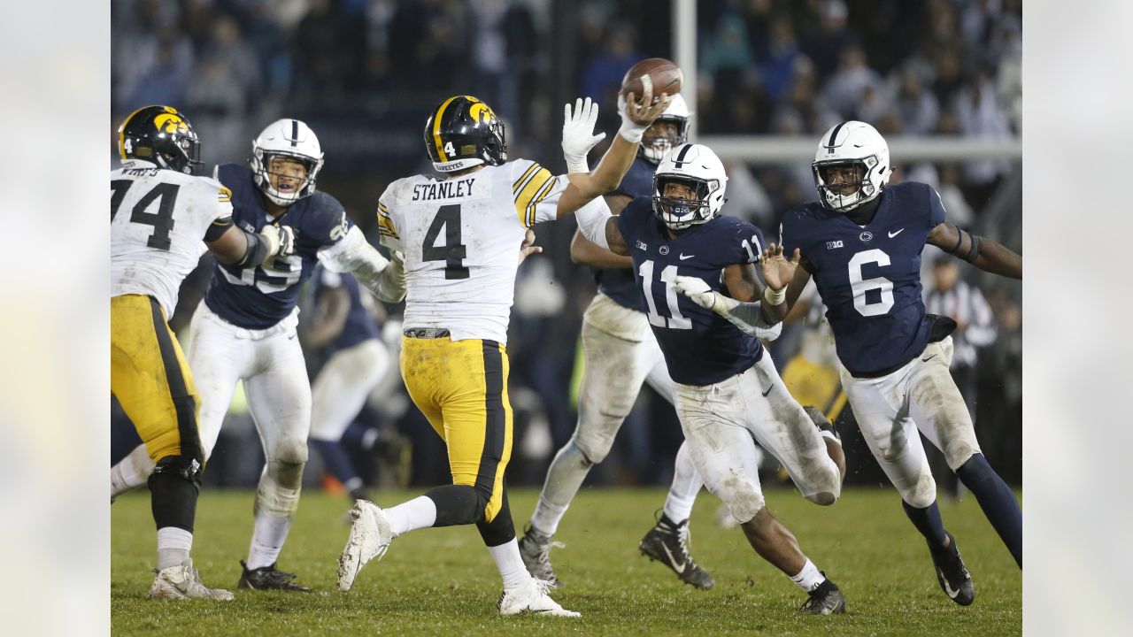 Penn State defensive end Shaka Toney (18) tackles Idaho quarterback Colton  Richardson (19) in the second quarter of an NCAA college football game  against Idaho in State College, Pa., on Saturday, Aug.