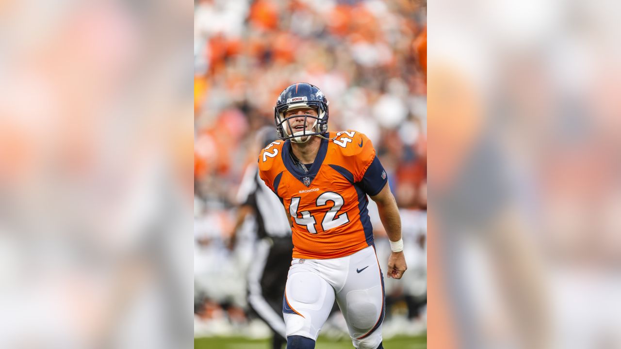 Denver Broncos kicker Brandon McManus (8) kicks the game winning field goal  as punter Marquette King (1) holds during the second half of an NFL  football game against the Oakland Raiders, Sunday