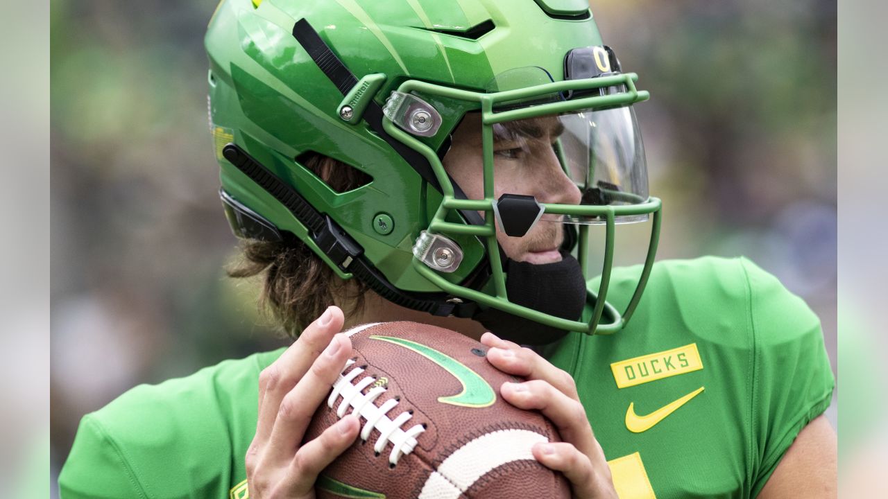 Justin Herbert Oregon Ducks Unsigned All White Throwing Photograph