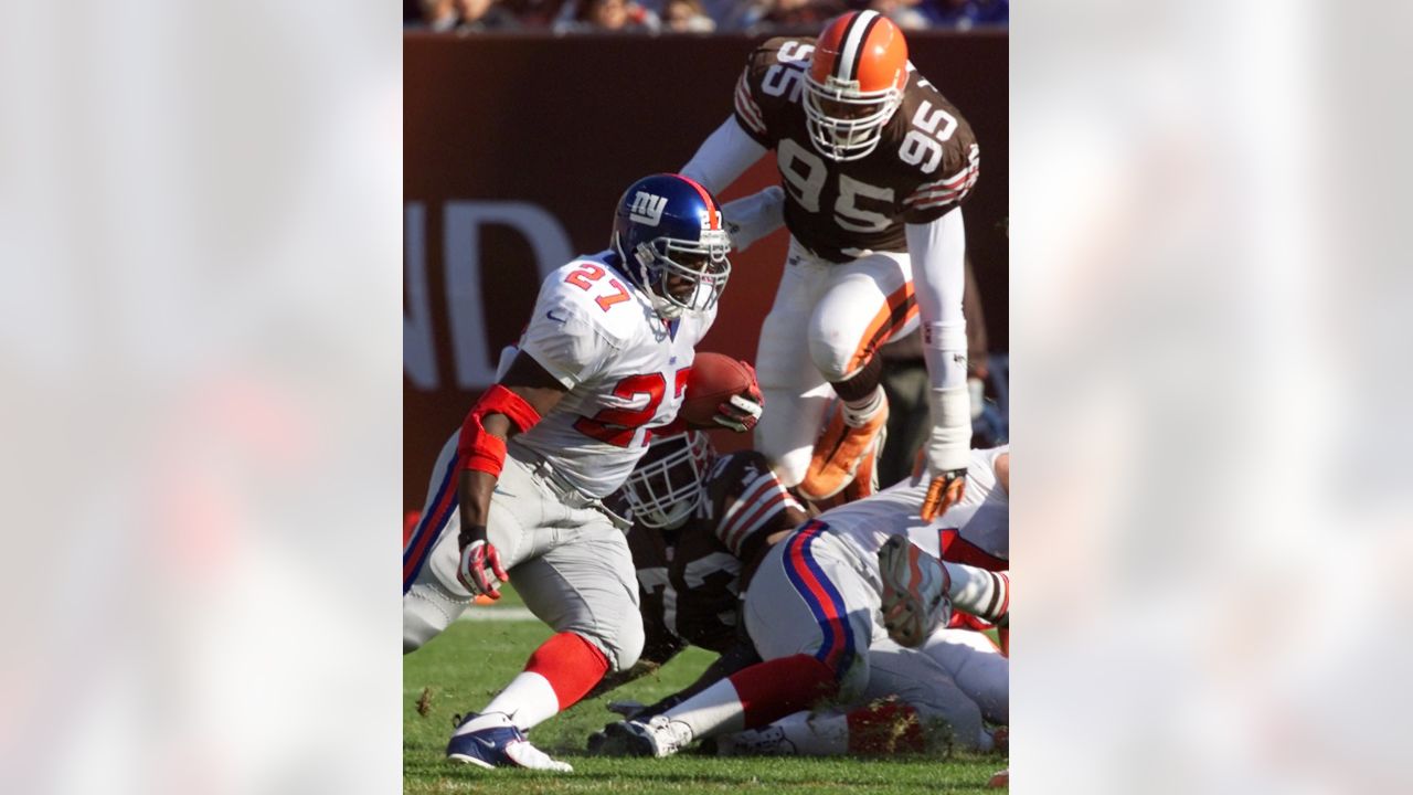 Guard Andy Gross (64) of the New York Giants reaches for an elusive pigskin  fumbled by Cleveland Browns Carl Ward (27) during a return of Giants  kickoff in the third quarter at