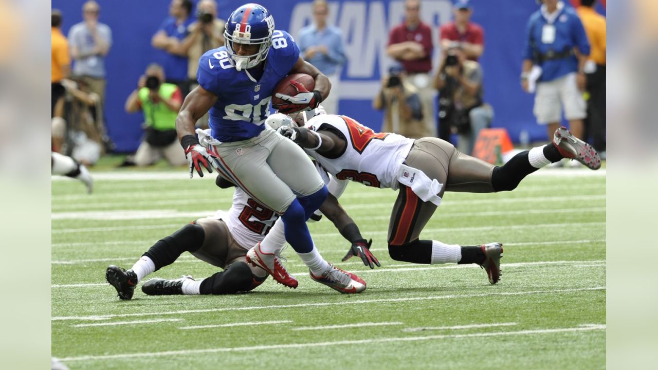 New York Giants wide receiver VICTOR CRUZ celebrates his 34 yard catch