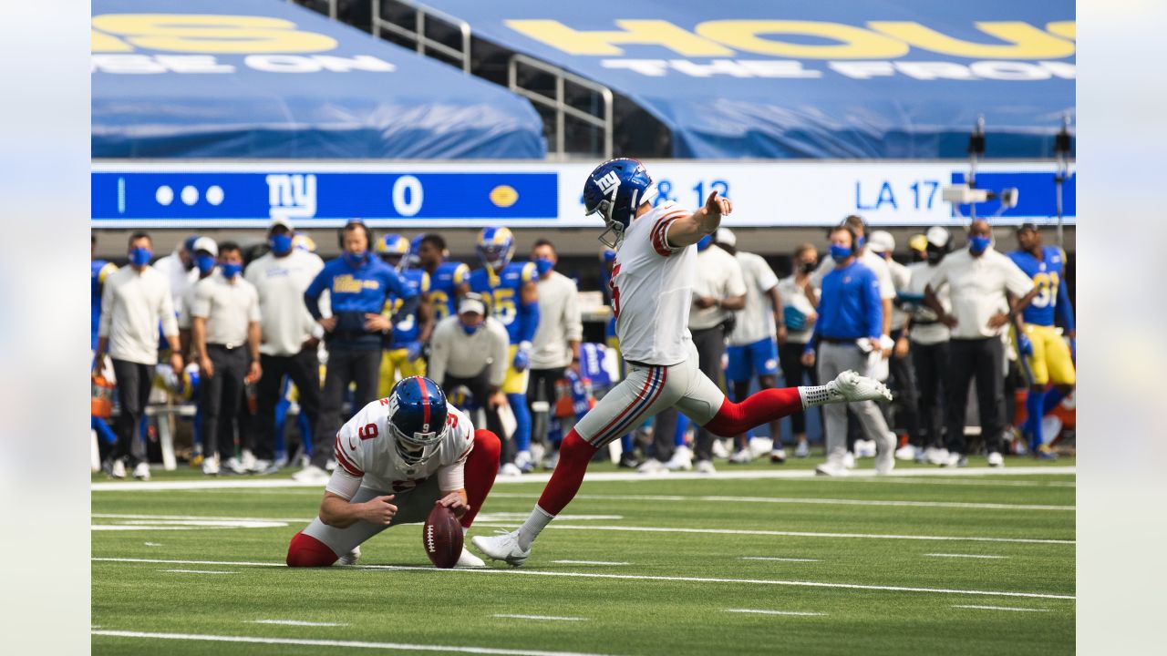 New York Giants kicker Graham Gano (5) gets a pat on the helmet from punter Riley  Dixon (9) after Gano kicked a field goal in the second quarter of an NFL  football