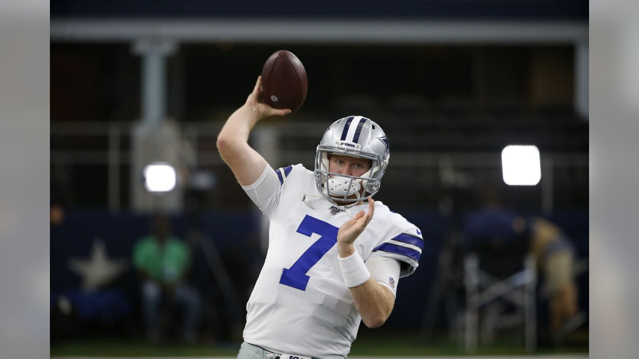 Dallas Cowboys quarterback Cooper Rush warms up before the game