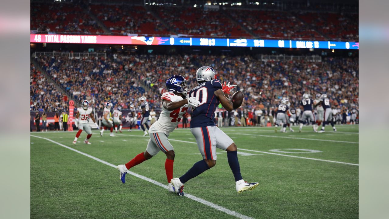 New York Giants cornerback Julian Love (37) tackles New England Patriots  wide receiver Julian Edelman in the first half of an NFL preseason football  game, Thursday, Aug. 29, 2019, in Foxborough, Mass. (