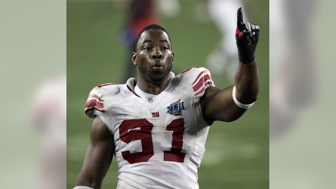 Like the Giant he is, Justin Tuck focuses grimly on the task at hand -  POLITICO