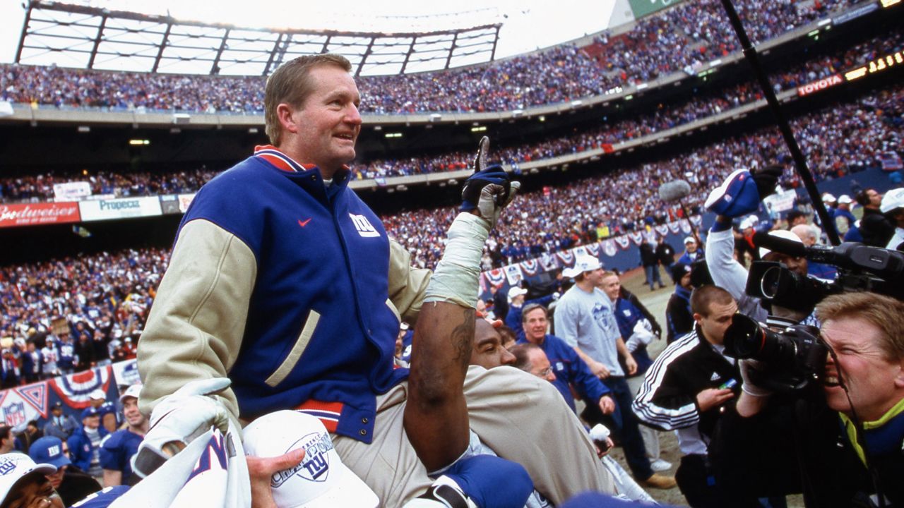 New York Giants head coach Jim Fassel wears his 2000 Super Bowl