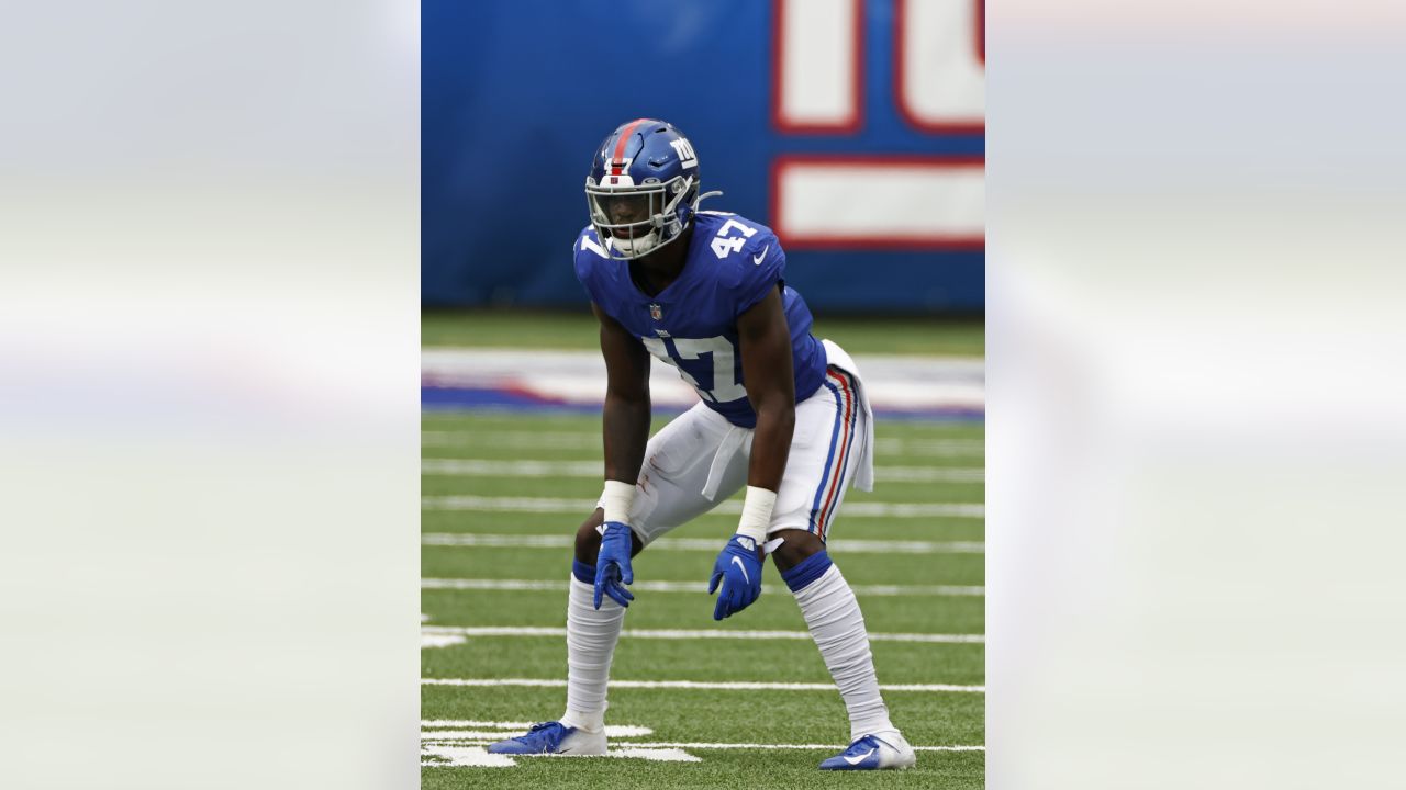 New York Giants linebacker Cam Brown (47) runs off the field