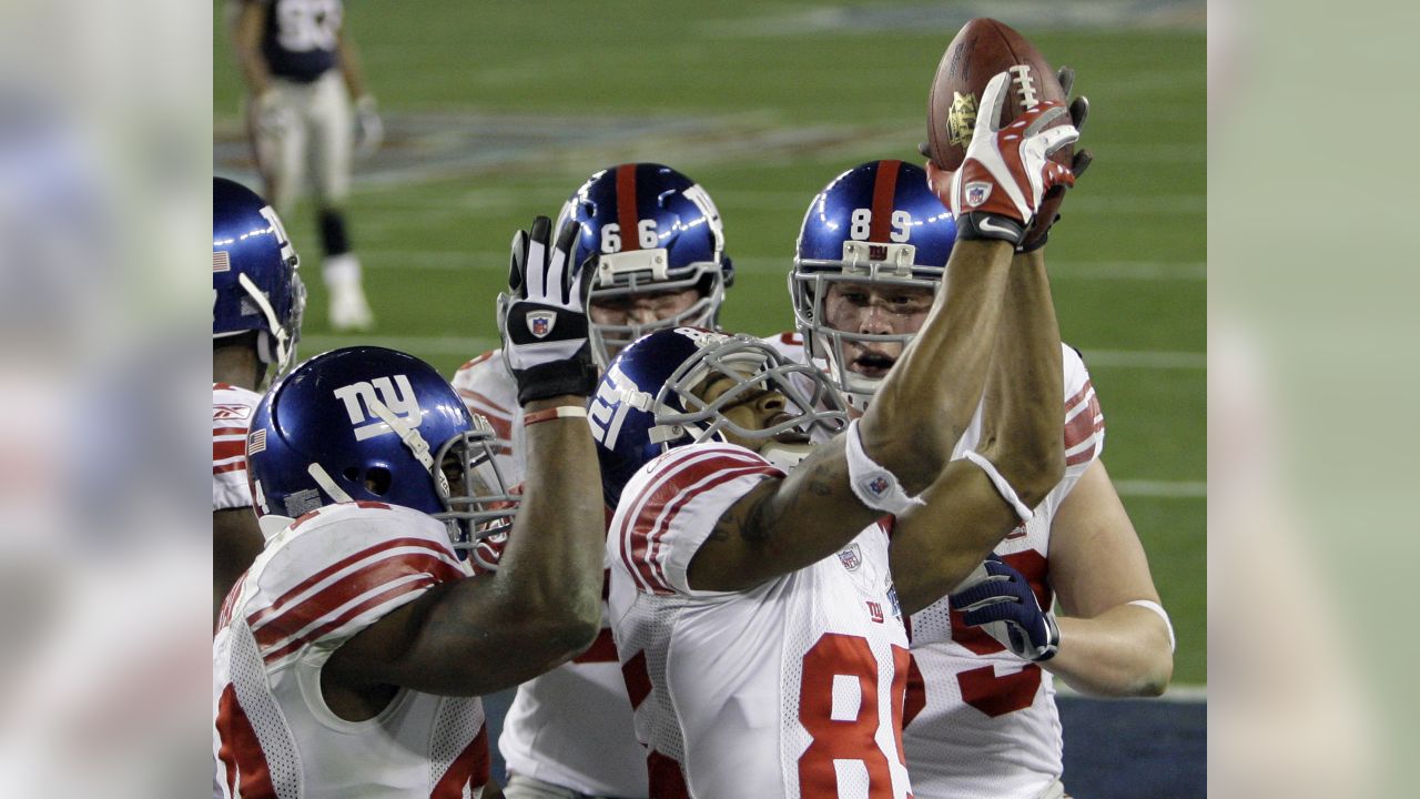 New York Giants wide receiver Hakeem Nicks (88) and wide receiver Mario  Manningham (82) celebrate Manningham's touchdown during second quarter NFL  action between the New York Giants and Detroit Lions at the