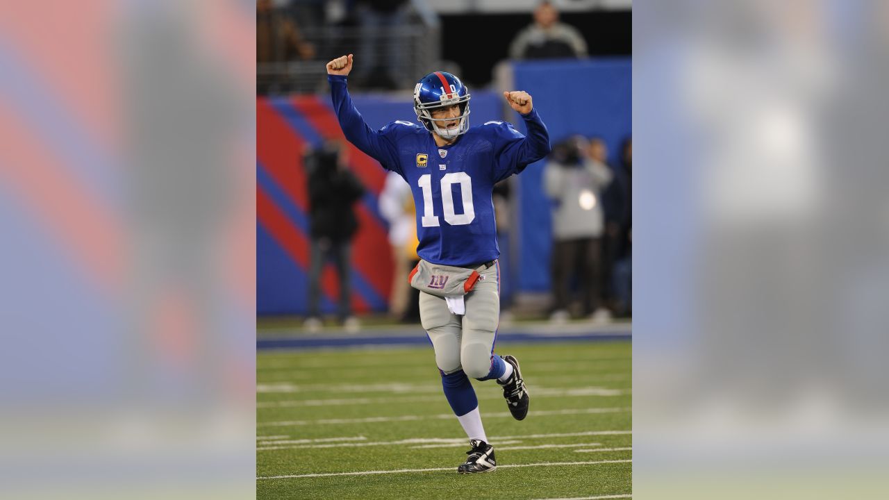 New York Giants Eli Manning celebrates after Plaxico Burress catches a 9  yard touchdown pass in the second quarter against the Philadelphia Eagles  at Giants Stadium in East Rutherford, New Jersey on